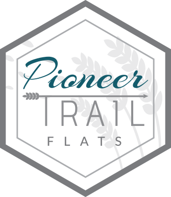 Pioneer Trail Flats Logo